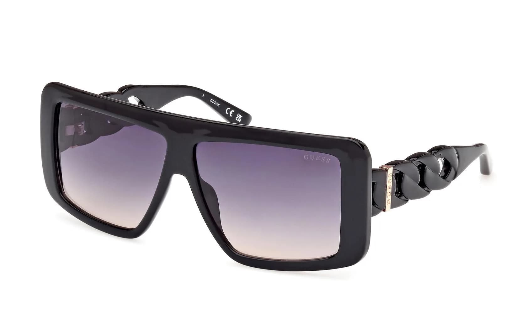 Guess GU00109 shield sunglasses in Shiny Black with gradient smoke lenses (01B), front three-quarter view showing the chain-link temple