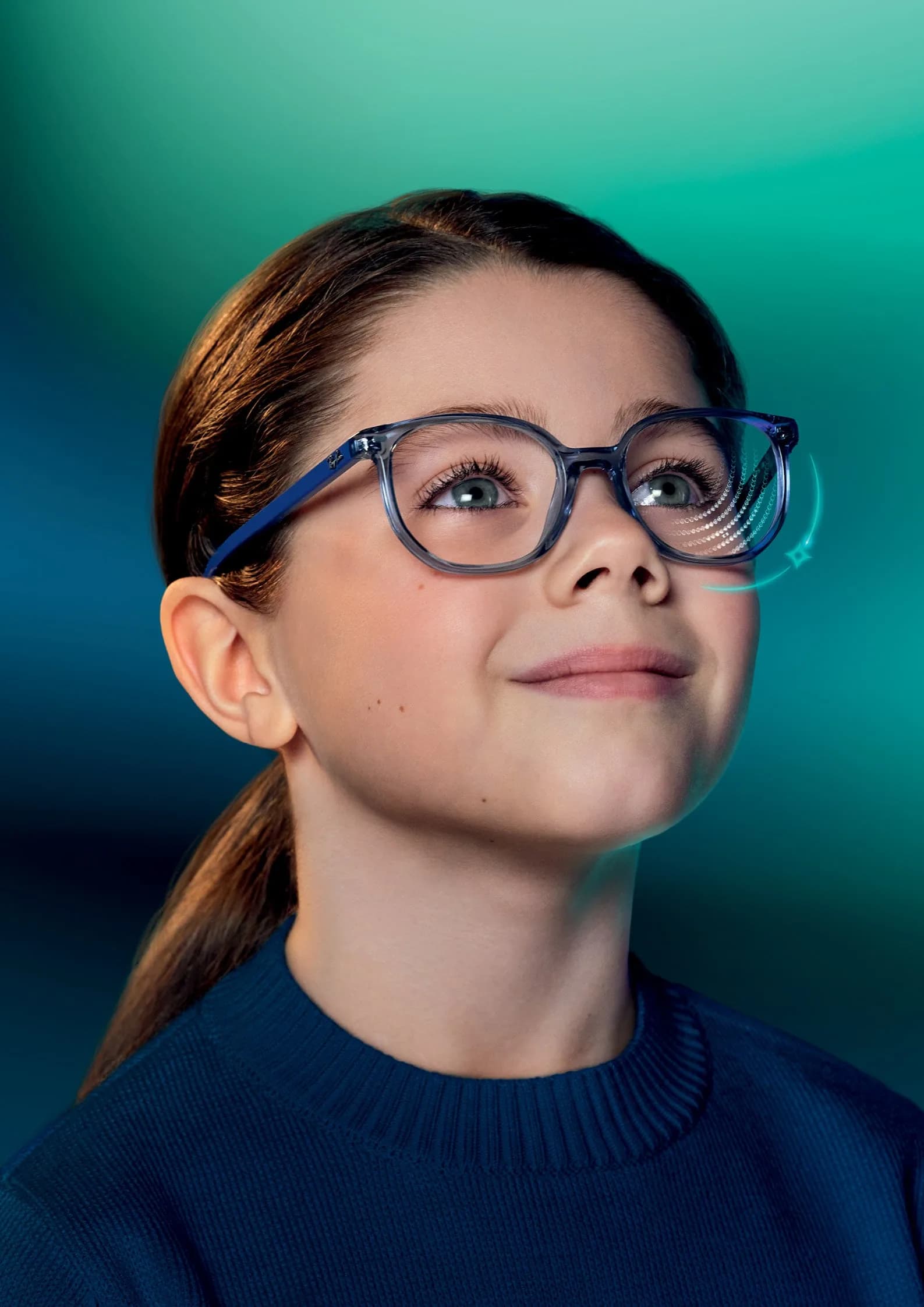 Essilor Stellest 2.0 Lenses, child wearing spectacles with the lens's lenslet rings illustrated on one lens