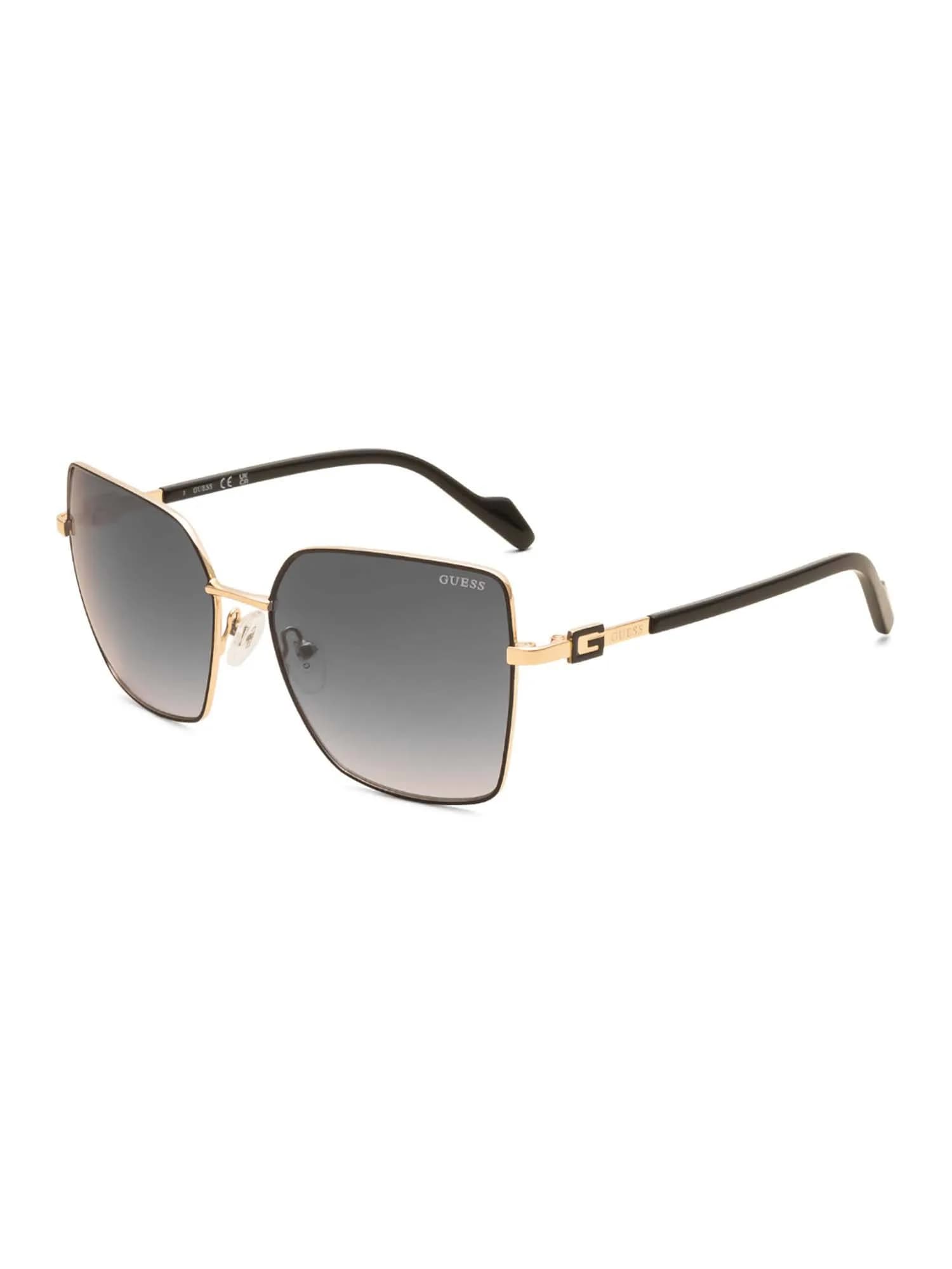 Guess GU00377 02B cat-eye sunglasses with a black and gold metal frame, G logo temples and gradient smoke lenses, front three-quarter view