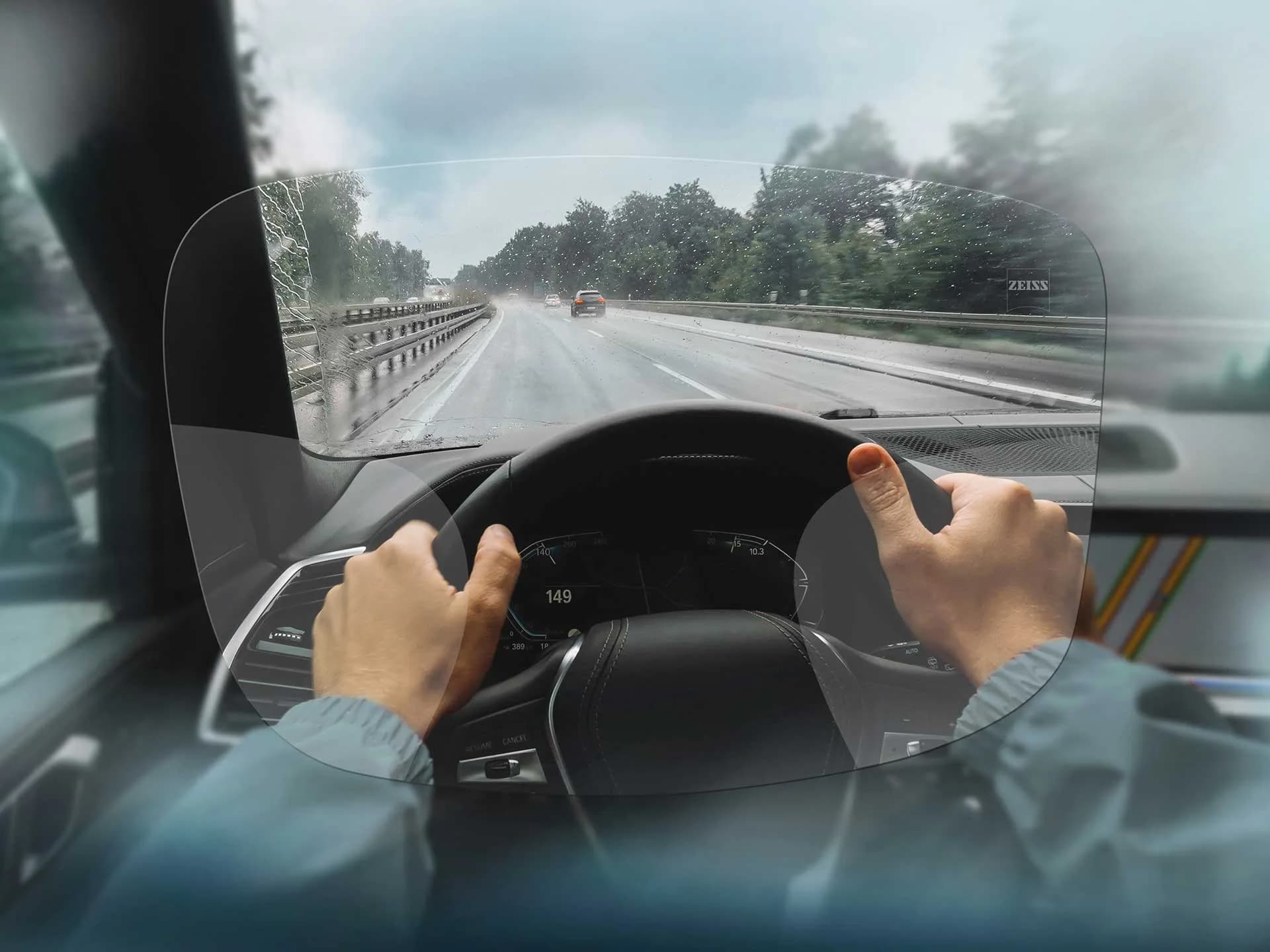 ZEISS Progressive DriveSafe Individual Lenses, view through a ZEISS DriveSafe progressive lens from the driver's seat on a rainy road