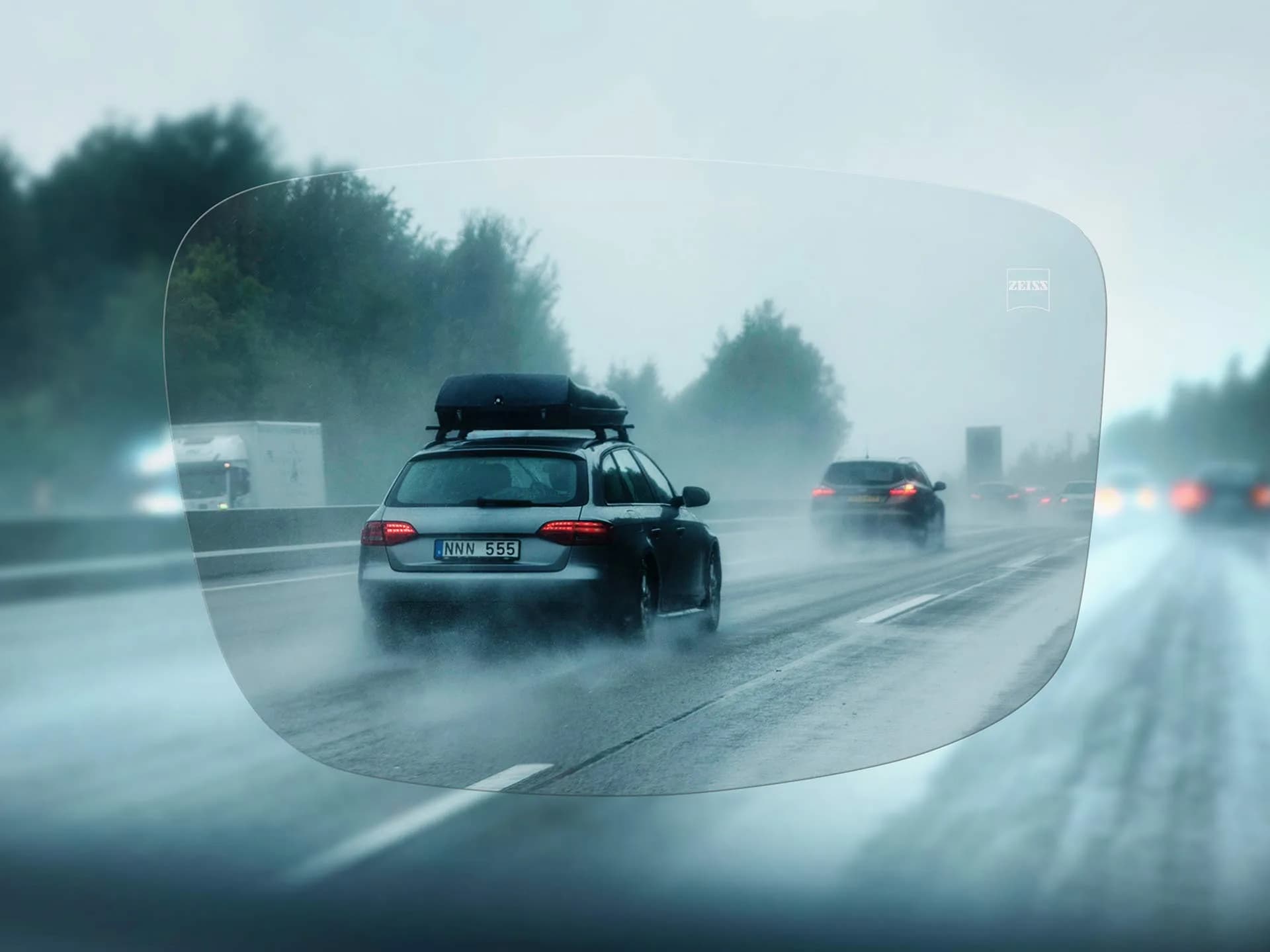 ZEISS Single Vision DriveSafe Individual Lenses, view through a ZEISS DriveSafe single vision lens of traffic on a rainy motorway