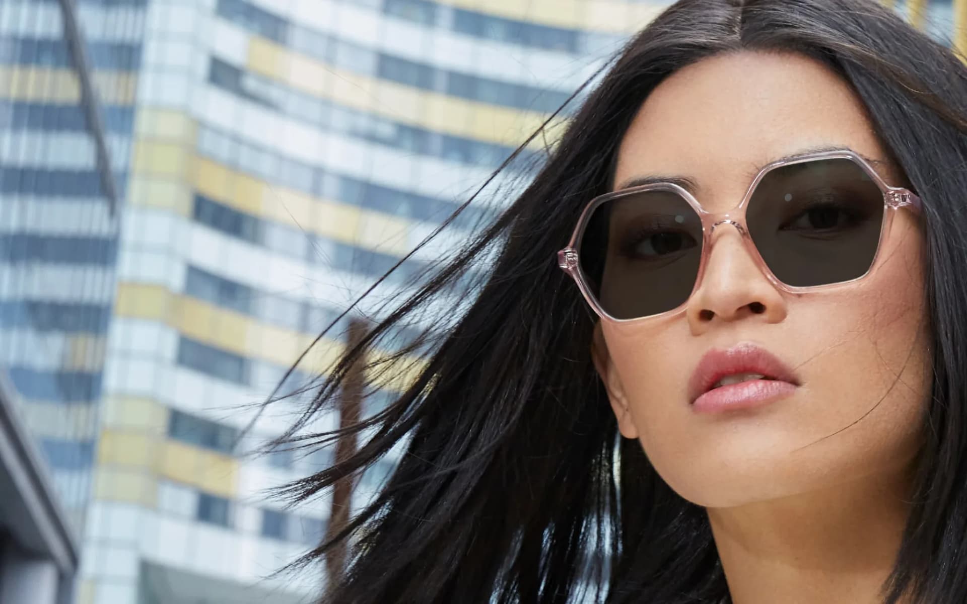 Essilor Transitions Rx SV Xtractive NG Lenses, woman outdoors wearing activated dark grey Transitions XTRActive new generation lenses