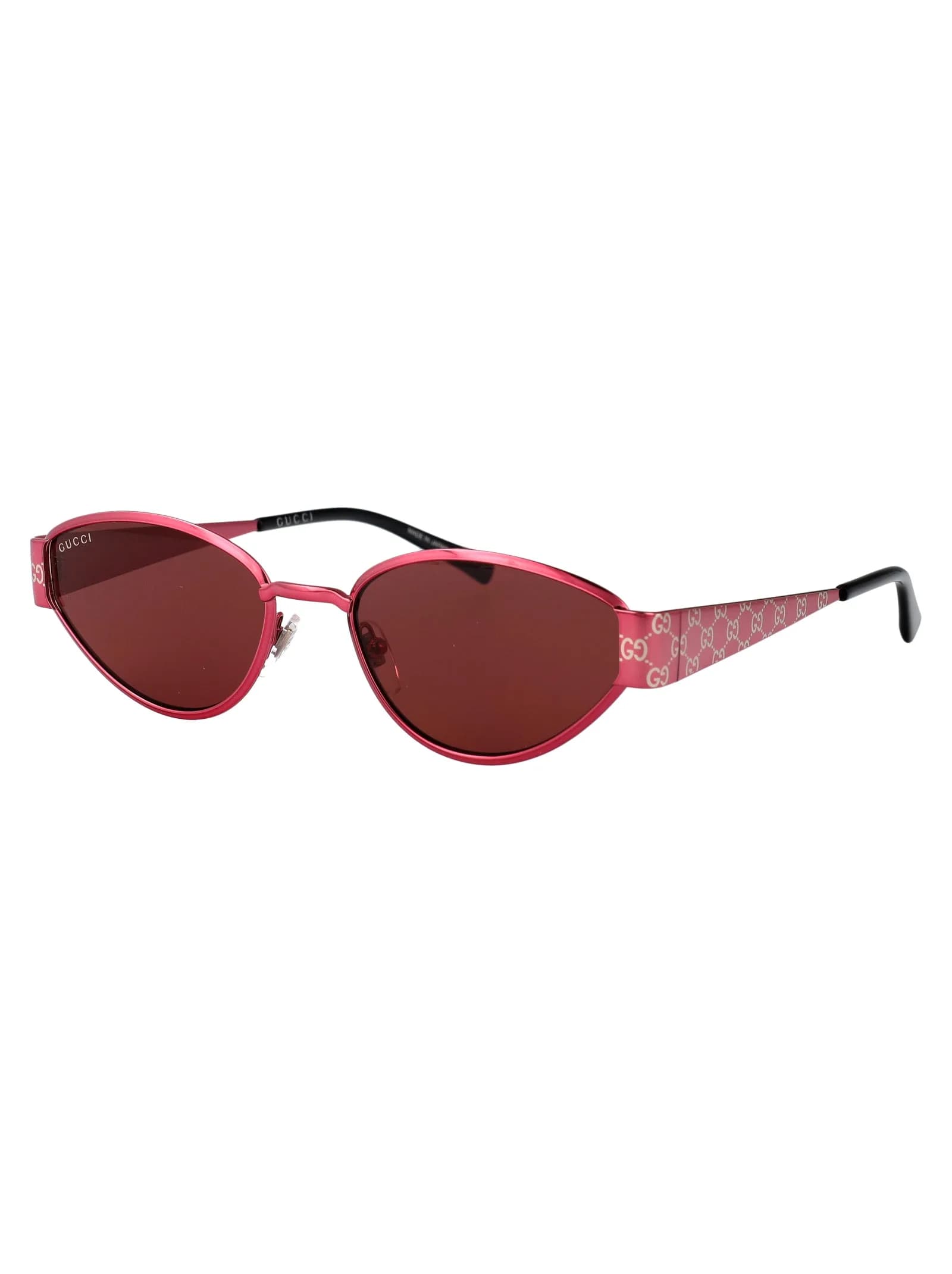 Gucci GG1853S 004 fuchsia metal oval sunglasses with red lenses and GG monogram temples, three-quarter view